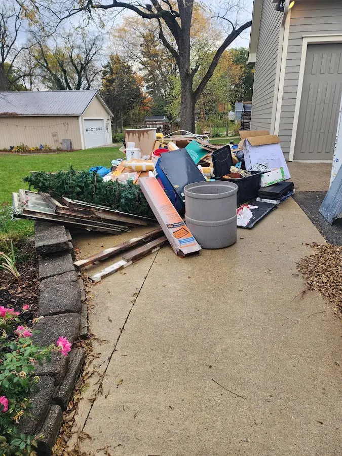 Dumpster being loaded with debris for Commercial Dumpster Rental in Campbellsville